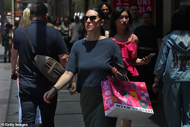 Australian home borrowers have been dealt a severe blow just before Christmas with the Reserve Bank denying them a rate cut (pictured is a Sydney shopper)