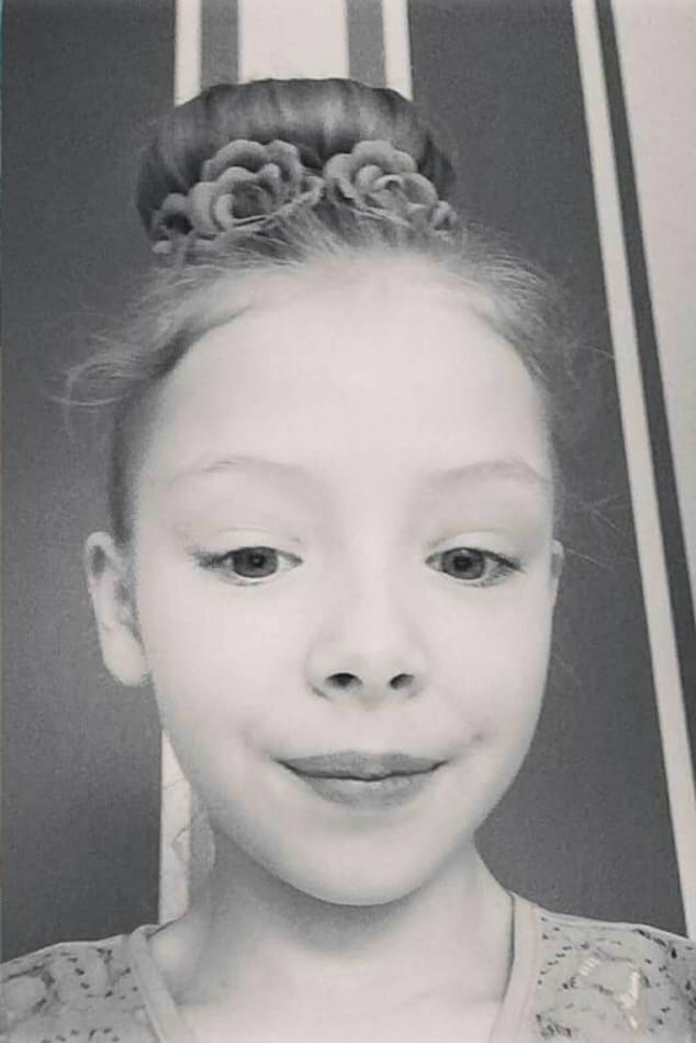 Photos show her smiling and wearing smart clothes with her dressed up in a bun