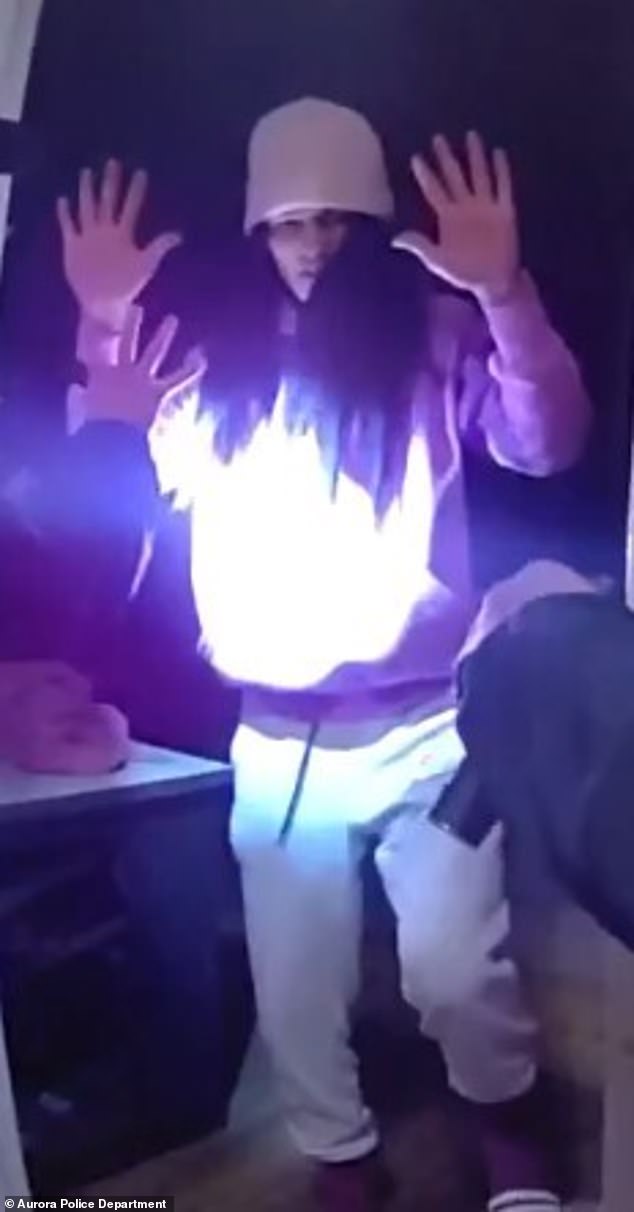 Niefred Jose Serpa-Acosta, 20, a known TdA member, presents himself to police with hands up and dressed as a woman. Officers encountered Serpa-Acosta on Dec. 16 after he took part in a vicious the kidnapping and torture of a Venezuelan couple