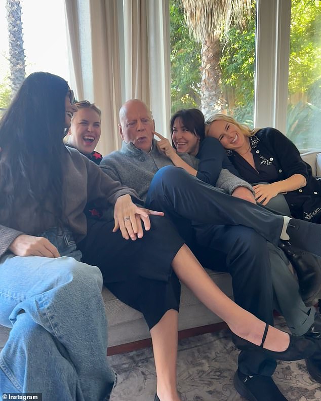 Bruce Willis is pictured above with part of his family in a post shared by ex-wife Demi Moore for his 70th birthday