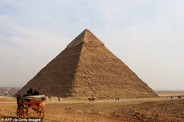 The wells and chambers were identified by sending 'high-frequency electromagnetic waves' into the subsurface, and the way signals bounced back allowed researchers to map structures beneath the Khafre pyramid (pictured)