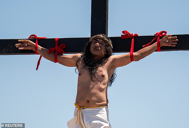 Filipino Catholic Ruben Enaje is nailed to the cross during his reenactment of the crucifixion of Jesus Christ on Good Friday, in San Fernando, Philippines, April 18, 2025