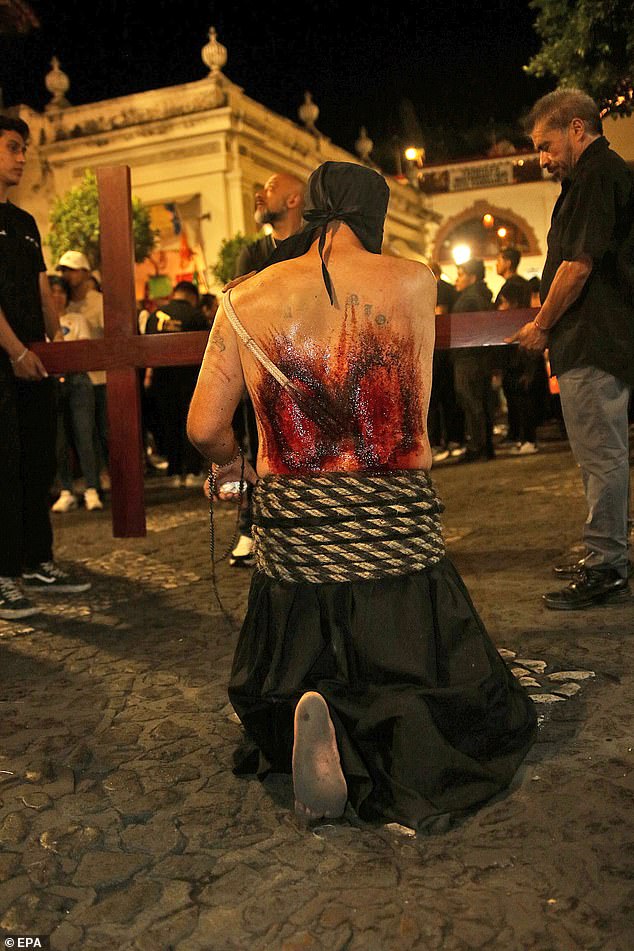 A penitent flagellates himself with a spiked belt as he attends the 'Procession of Christs' on Maundy Thursday as part of Holy Week celebrations in Taxco, Mexico, 17 April 2025