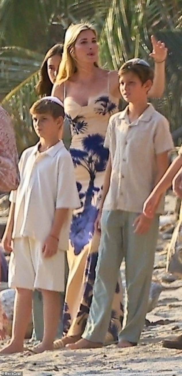 The blonde beauty donned a skin-tight white gown with a blue floral pattern, which showcased her toned physique