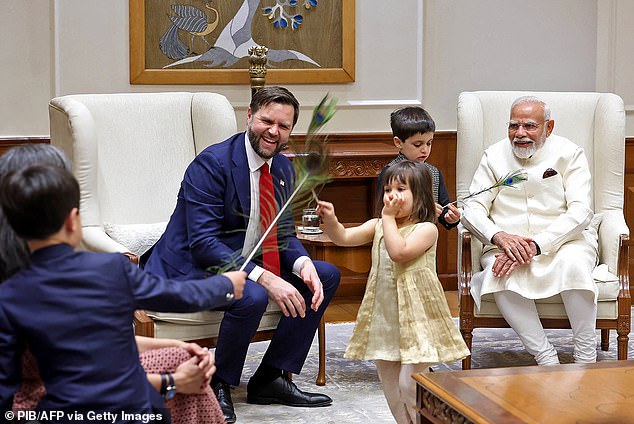 India's Prime Minister Narendra Modi (R) hosting US Vice President JD Vance (2L), wife Usha Vance (L back) and their children Mirabel (C), Ewan (2R) and Vivek at his residence in New Delhi.
