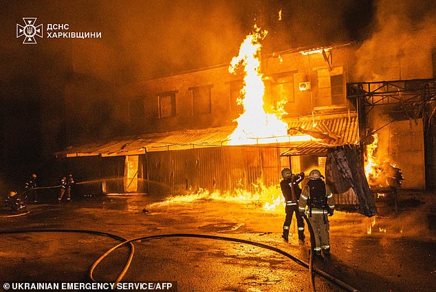 Firefighters extinguish a fire following a drone attack in Poltava, amid the Russian invasion of Ukraine