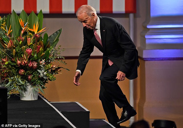 Biden became known for his uneasy gait and shuffle, often leading to trip, stumbles, fumbles and outright falls. Pictured: Then-Vice President Joe Biden trips up the steps of a stage before a speech at a Paddington Town Hall in Sydney, Australia on July 20, 2016