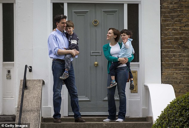 Ed Miliband and wife Dame Justine Thornton pose outside their £3m Victorian home in Dartmouth Park with sons Daniel and Samuel a decade ago, after he resigned as Labour leader