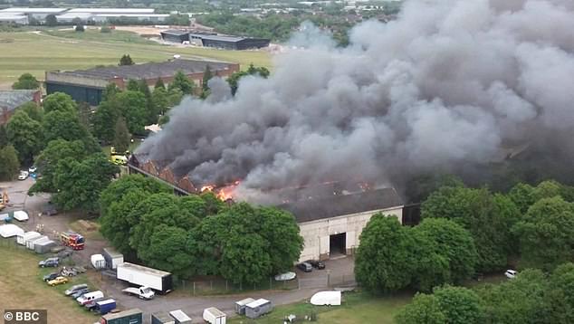 Two firefighters and a member of the public have been killed after a huge blaze ripped through a former RAF base near Bicester Village last night