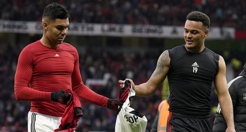 Man United midfielder Casemiro swaps shirts with Brazilian compatriot Rodrigo Muniz at half-time in defeat against Fulham... minutes before being substituted after he was left bloodied following a clash of heads