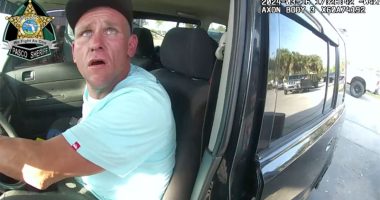 Bodycam captures deputy confront, fatally shoot suspect while dangling from car door