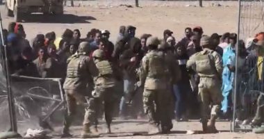 'This is an invasion': Shocking video footage shows mob of angry migrants breach border, rush National Guard soldiers