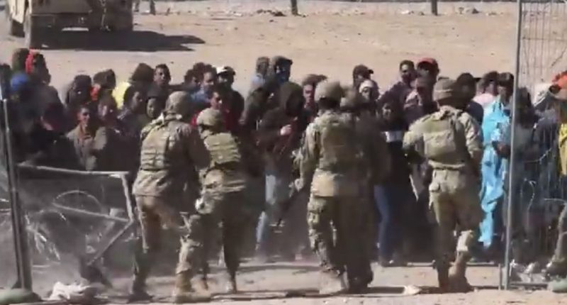 'This is an invasion': Shocking video footage shows mob of angry migrants breach border, rush National Guard soldiers