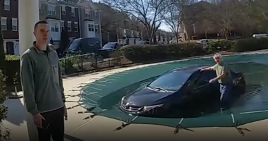 Video shows Georgia police rescuing driver stuck in car on top of covered pool