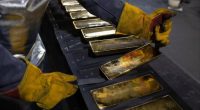 Gold hits new high as investors seek hedge against stubborn inflation