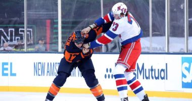 Matt Rempe #73 of the New York Rangers fights with Matt Martin #17 of the New York Islanders