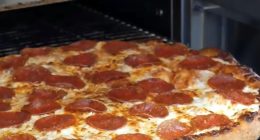 Burglar used stolen credit card to order pizza and have it delivered to his home, St. Louis police say.