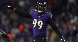 Ravens LB Odafe Oweh prepares for snap in playoffs against Texans.