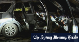Two cars set alight and driven into Melbourne mansion overnight