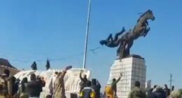 Dramatic moment Islamist rebels topple statue of Bashar Al Assad's brother as they storm Aleppo in Syrian president's biggest crisis yet - as Putin's forces hit back with airstrikes to help embattled regime