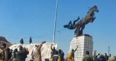 Dramatic moment Islamist rebels topple statue of Bashar Al Assad's brother as they storm Aleppo in Syrian president's biggest crisis yet - as Putin's forces hit back with airstrikes to help embattled regime