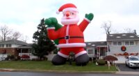 Homeowner's enormous inflatable Santa Claus balloon brings extra holiday spirit to Farmingdale, New York residents on Long Island