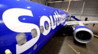 Southwest Airlines says it is ending cabin service earlier to reduce chance of injury