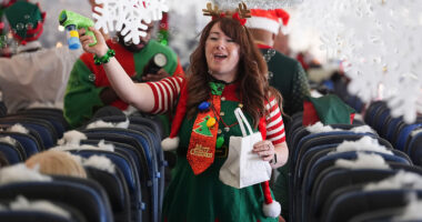 Flight takes kids to visit Santa at North Pole scene in transformed Denver airport hangar