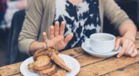 Woman refusing to eat bread