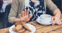 Woman refusing to eat bread