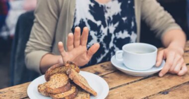 Woman refusing to eat bread