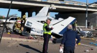 Aftermath of small plane crash onto Texas roadway caught on camera with split fuselage, damaged vehicles