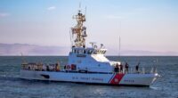 Coast Guardsman lashes out as White House brushes off claims vessel was trailed by 12 to 30 drones during patrol