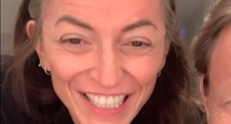 Davina McCall shows off her new haircut in fun clip after stylist partner Michael Douglas lovingly cut her locks following brain tumour surgery