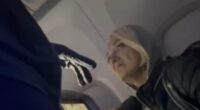 Delta stowaway is seen in new video begging flight attendants not to 'send her back to America' from Paris - as it's revealed she's Russian