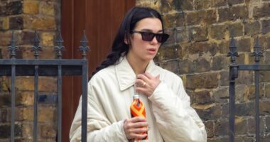 Dua Lipa flashes huge engagement ring after Callum Turner's romantic proposal as she goes makeup free for hot yoga session