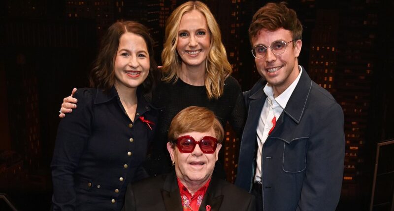 Elton John's battle with blindness: How 77-year-old star's husband David Furnish guided him around premiere as he was supported by stars including Liz Hurley after revealing he 'can't see'