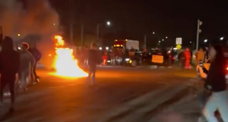 Fiery chaos at Florida intersection has sheriff's office searching for dozens of suspects