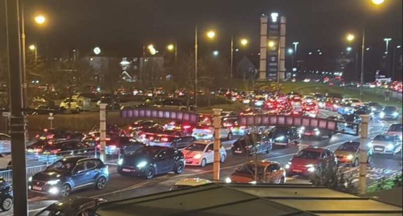 Fights break out after motorists get stuck in shopping centre car park for FIVE hours in hellish traffic jam