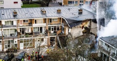 Frantic search for survivors after huge explosion at block of flats in The Hague as cops hunt ‘car seen speeding away’