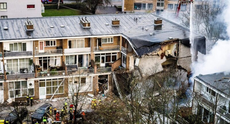 Frantic search for survivors after huge explosion at block of flats in The Hague as cops hunt ‘car seen speeding away’