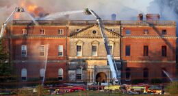 Grand plans to spend £63million on maintaining the fire-wrecked look for a Grade I listed mansion rather than restoring a 'great jewel of British architecture' is blasted as an 'act of barbarianism'