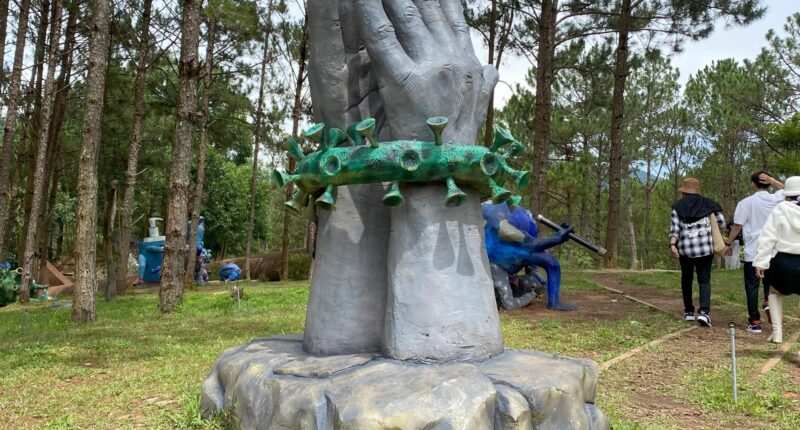 Inside Covid THEME PARK with ghoulish fairground dedicated to outbreak with giant viruses & creepy pandemic clock