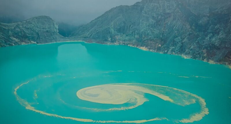 Inside volcano with world’s largest ACID lake that melts skin & spews blue lava