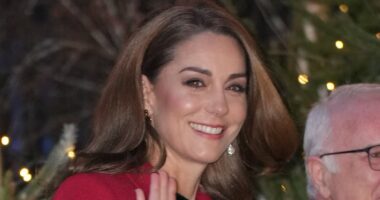 Kate Middleton stuns in festive red coat and black bow as she arrives at Westminster Abbey for carol concert