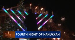 Menorah lighting held by Rabbi Baruch Hertz, Chabad of West Lakeview in Lincoln Square to mark 4th night of Hanukkah