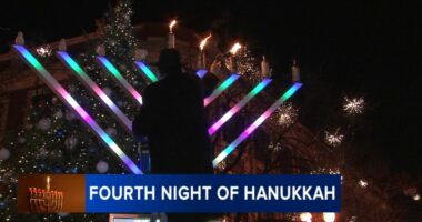 Menorah lighting held by Rabbi Baruch Hertz, Chabad of West Lakeview in Lincoln Square to mark 4th night of Hanukkah