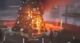 Moment Christmas tree is BURNED DOWN during Islamist protests in Syria amid fears for Christians after fall of Assad