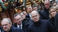 Moment German chancellor Olaf Scholz is heckled by angry mob in Magdeburg as questions remain over 'warnings about Christmas market attack suspect'