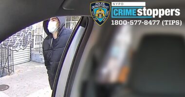 NYPD releases two NEW pictures of healthcare boss's assassin during his getaway in the back of a cab